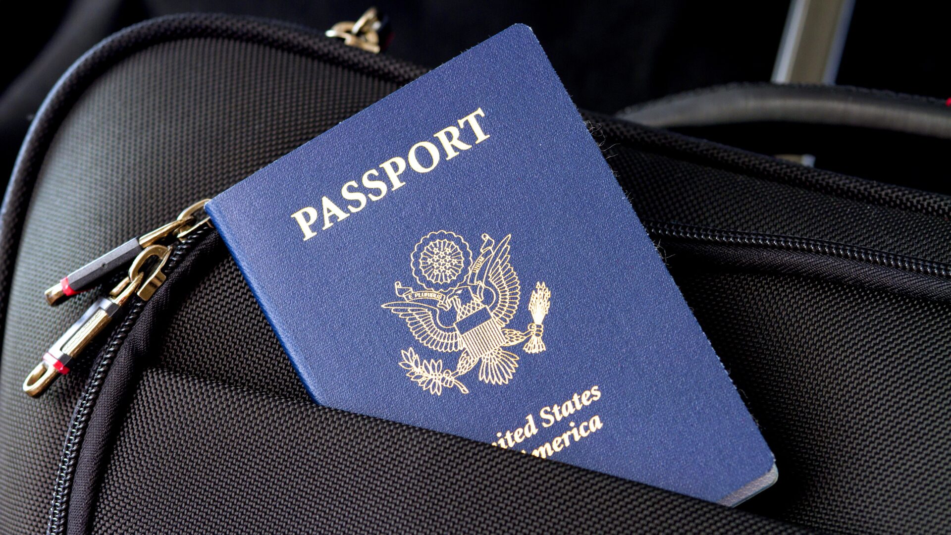 Passport sticking outside of travel bag